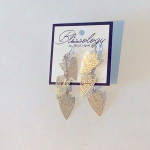 Gold arrowhead dangle earrings